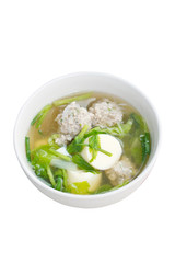 Clear soup with egg tofu, minced pork and vegetable Isolated on