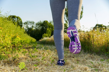 Woman running in a field