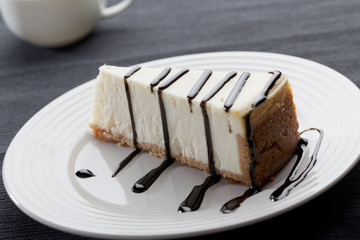 Slice of cheesecake with liquorice sauce