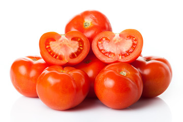 Fresh tomatoes isolated on white.