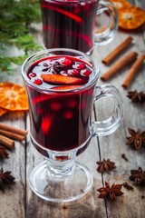 homemade mulled wine with orange slices, cranberries, cinnamon and anise