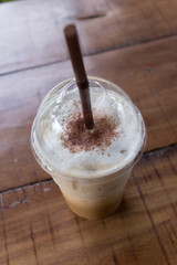 ice coffee drink on wooden table, coffee break in cafe