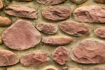 mur en pierre rose
