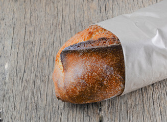 Great bread placed on wooden floor.