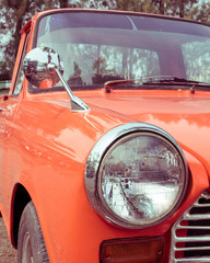 close-up headlight of colourful classic car
