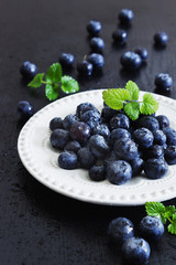  blueberries in a white plate