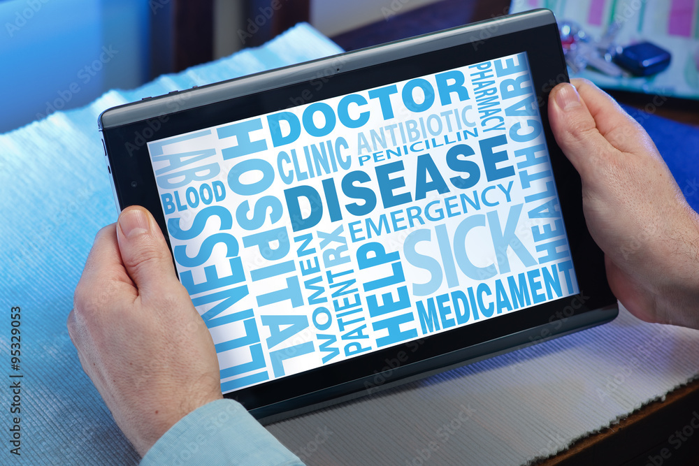 Fototapete hands of a man looking words cloud related disease in the tablet / man looking with tablet a screen 