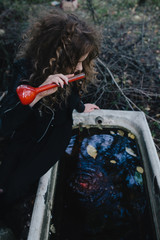 Vintage witch with elixir in hand