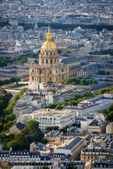 Fototapeta na wymiar Aerial view of gold dome of the Invalides rising above rooftops of the 7th arrondissement, on the Left Bank of Paris, France