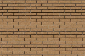 wall of  yellow raised thin bricks