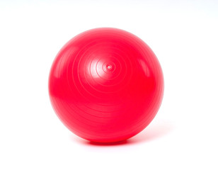 Red fitness ball on white background