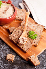 liver pate with parsley and bread, close-up, vertical, top view