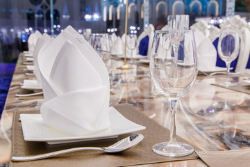 Wedding table at a wedding feast decorated with bridal bouquet