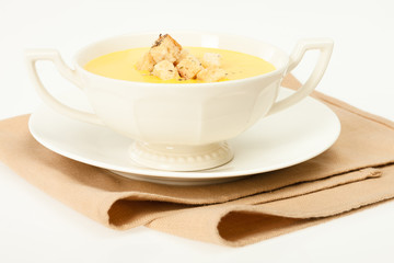 Pumpkin cream soup with breadcrumbs.