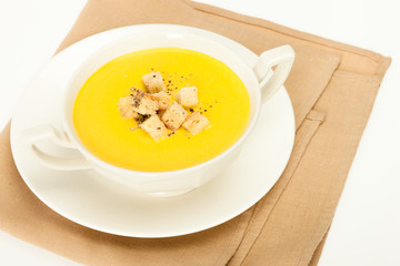 Pumpkin cream soup with breadcrumbs.