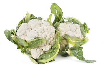 Two fresh young ripe cauliflower with leaves isolated on white background