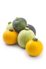 Young fresh courgettes (zucchini) isolated on white