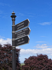 Signpost in English and Welsh in the Grounds of Bodelwyddan Castle in North Wales