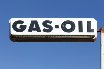Old and vintage gas oil sign on a pole