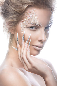 Beautiful fashion model with long nails, creative makeup and manicure design. Beauty face art