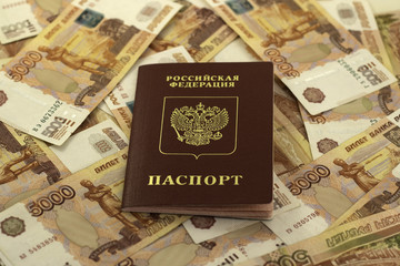 Russian passport on a background of money
