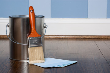 Paint brush and samples in a bedroom