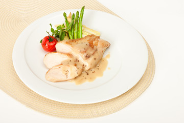 Fried chicken fillet in white cream sauce