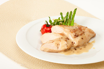 Fried chicken fillet in white cream sauce
