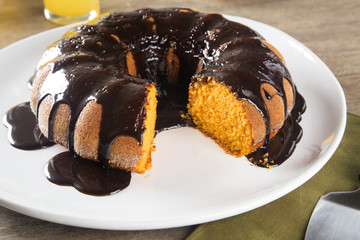 Carrot cake with chocolate and slice on the table