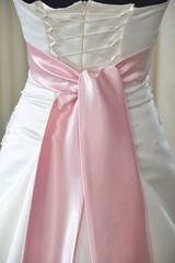 wedding dress with pink bow and corset