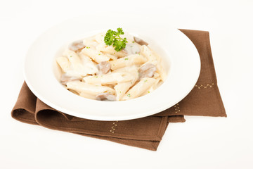Pasta with mushrooms in white cream sauce