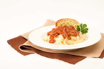 Pasta bolognese with garlic bread