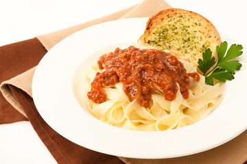 Pasta bolognese with garlic bread