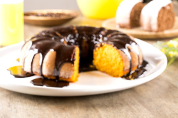 Carrot cake with chocolate and slice on the table