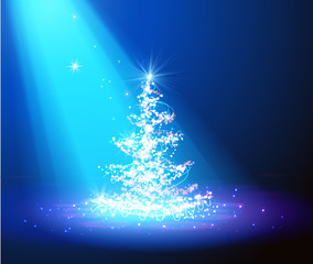 Christmas tree with defocused lights. blue background