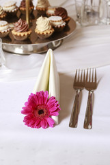 Napkin decorated with pink gerbera flower