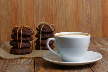 Cup of coffee and two stack of cookies