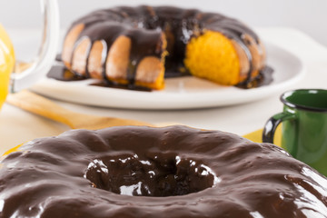 Carrot cake with chocolate and slice on the table