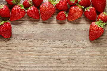 Fresh strawberries on wood