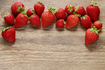 Fresh strawberries on wood