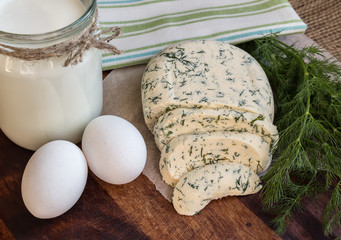 Homemade cheese with dill, milk and eggs