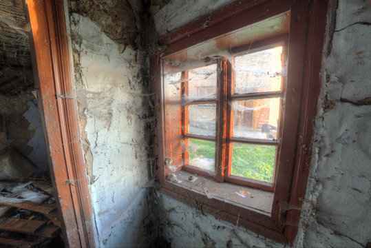 Small old window in abandoned house