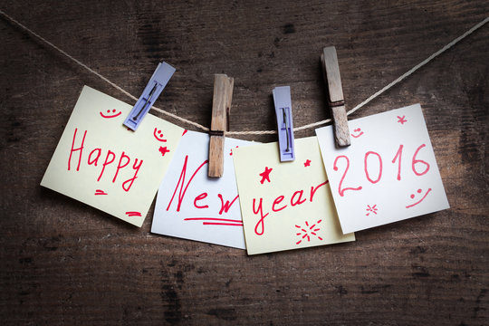 Happy New Year card on wooden background