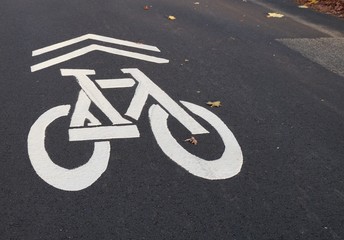 Bicycle lane white sign marked on road asphalt