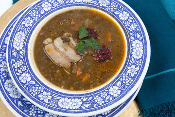 Traditional spanish lentils and sausage stew with pork