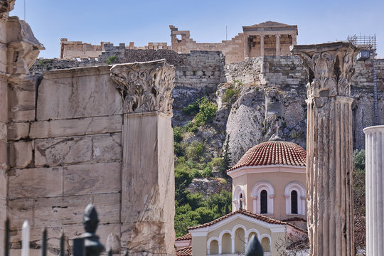 Athens Greece, scenic view of acropolis over Hadrian's library columns and old church