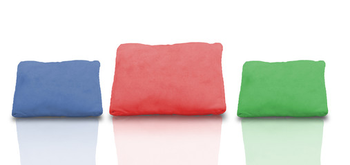 Colourful Collage of pillows with reflection on white background