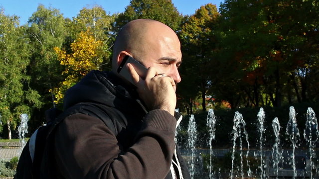 Man telephoning outdoors