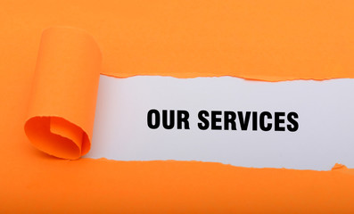 Over Services wrriten with folded paper sheet