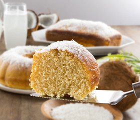 coconut cake with slice on the table